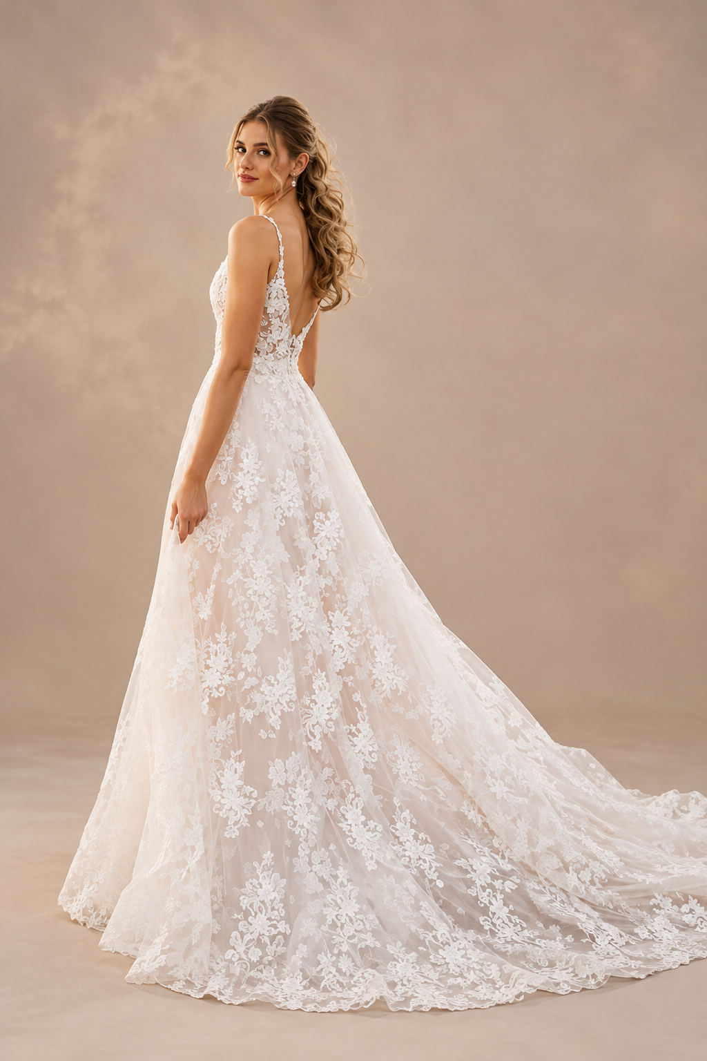 JOLENE A timeless mermaid wedding dress featuring a beautifully detailed lace bodice with a deep illusion V-neckline and delicate beaded straps. The sleek fitted silhouette flows effortlessly into a soft flared skirt and graceful lace-edged train