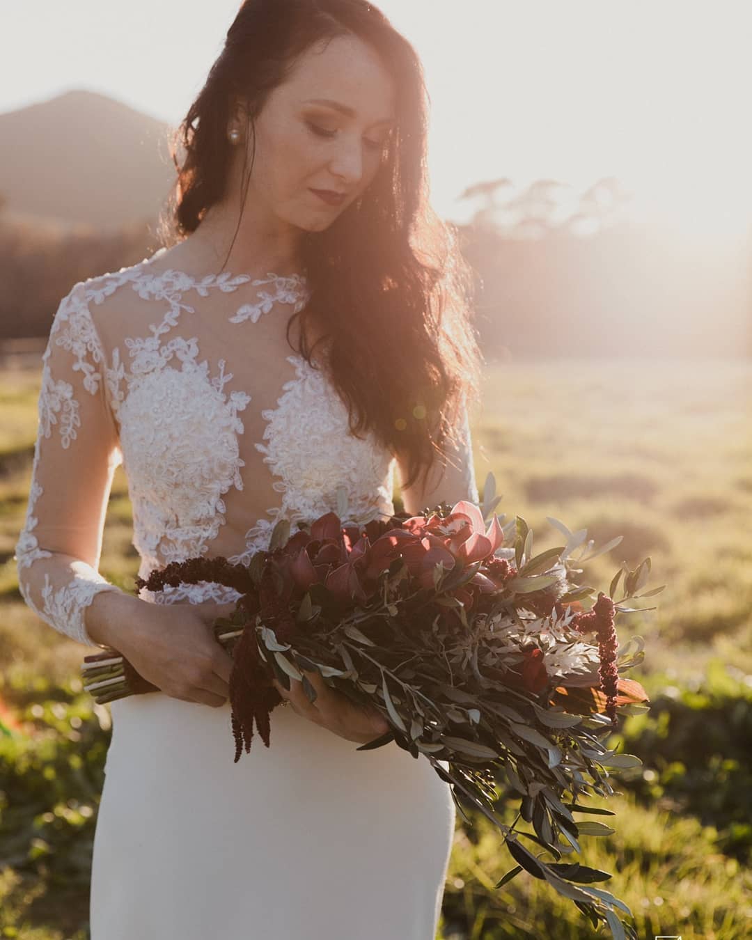 juliana Lace Bodice & Crepe Mermaid Gown with Sheer Sleeves  The Juliana gown is a timeless blend of refined sophistication and modern romance. Featuring a delicate sheer lace bodice and a sleek crepe mermaid skirt, this design is perfect for the bride who desires elegance, structure, and just the right amount of drama.  ✨ Design Highlights: ✔ Sheer Lace Bodice – Intricate lace appliqués placed over soft illusion tulle for a romantic and lightweight feel. ✔ Long Lace Sleeves – Fitted and sheer, offering coverage with elegance, ideal for cooler seasons or classic bridal style. ✔ Button Closure Back – A row of bridal buttons along the back adds timeless charm and refinement. ✔ Fitted Crepe Mermaid Skirt – Smooth, figure-enhancing crepe flares beautifully from the knees for a graceful silhouette. ✔ Long Flowing Train – Creates a dramatic and unforgettable bridal entrance.  💫 Customization Options: ✅ Custom sizing tailored to your shape ✅ Option to adjust sleeve length or add a satin lining under the lace ✅ Available in soft white, ivory, or off-white tones ✅ Add a matching lace veil or detachable overskirt for added drama  👰 Juliana is for the bride who seeks a look of refined grace—where every curve, lace motif, and train flows with poise and quiet beauty. 👰  📞 Schedule your consultation or fitting today! 📧 info@bestersbridal.co.za | 📱 084 268 1354