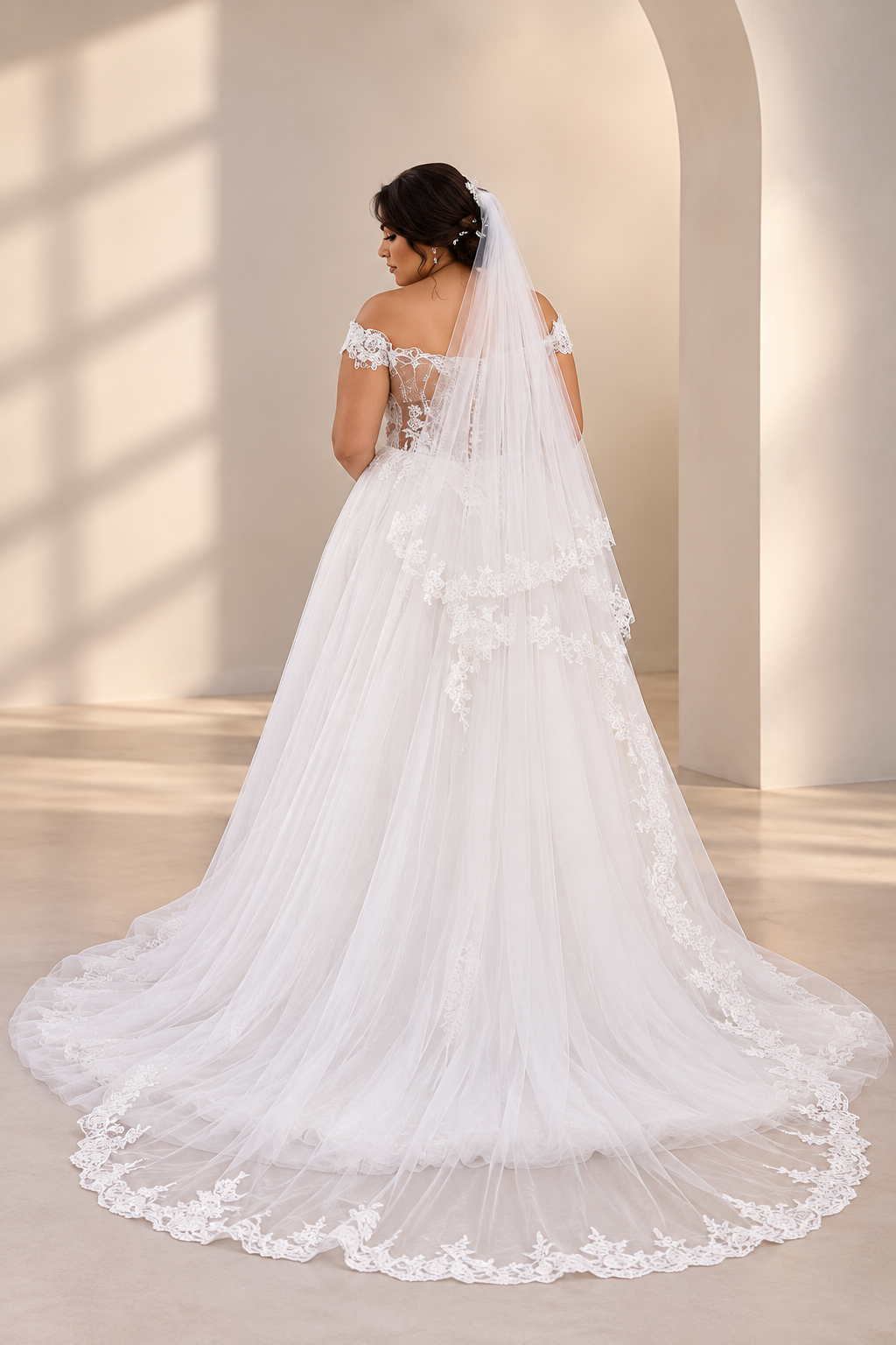 JOLENE A timeless mermaid wedding dress featuring a beautifully detailed lace bodice with a deep illusion V-neckline and delicate beaded straps. The sleek fitted silhouette flows effortlessly into a soft flared skirt and graceful lace-edged train