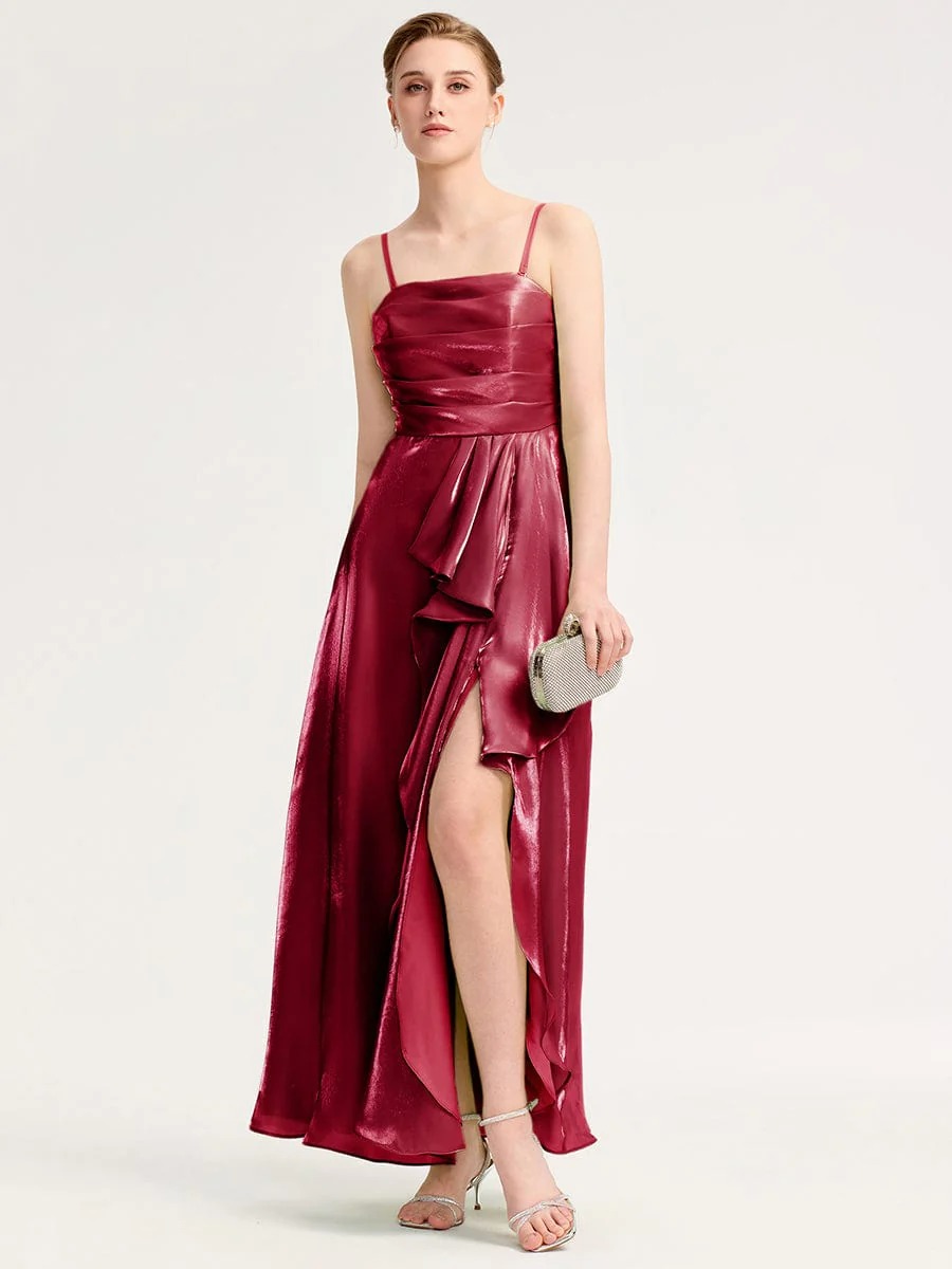 Elevate your evening style with this stunning green satin dress. Featuring a flattering silhouette, delicate spaghetti straps, and an elegant front slit, it offers both sophistication and comfort. The iridescent fabric catches the light beautifully, making it perfect for formal events or special occasions. Pair it with your favorite accessories for a complete look.