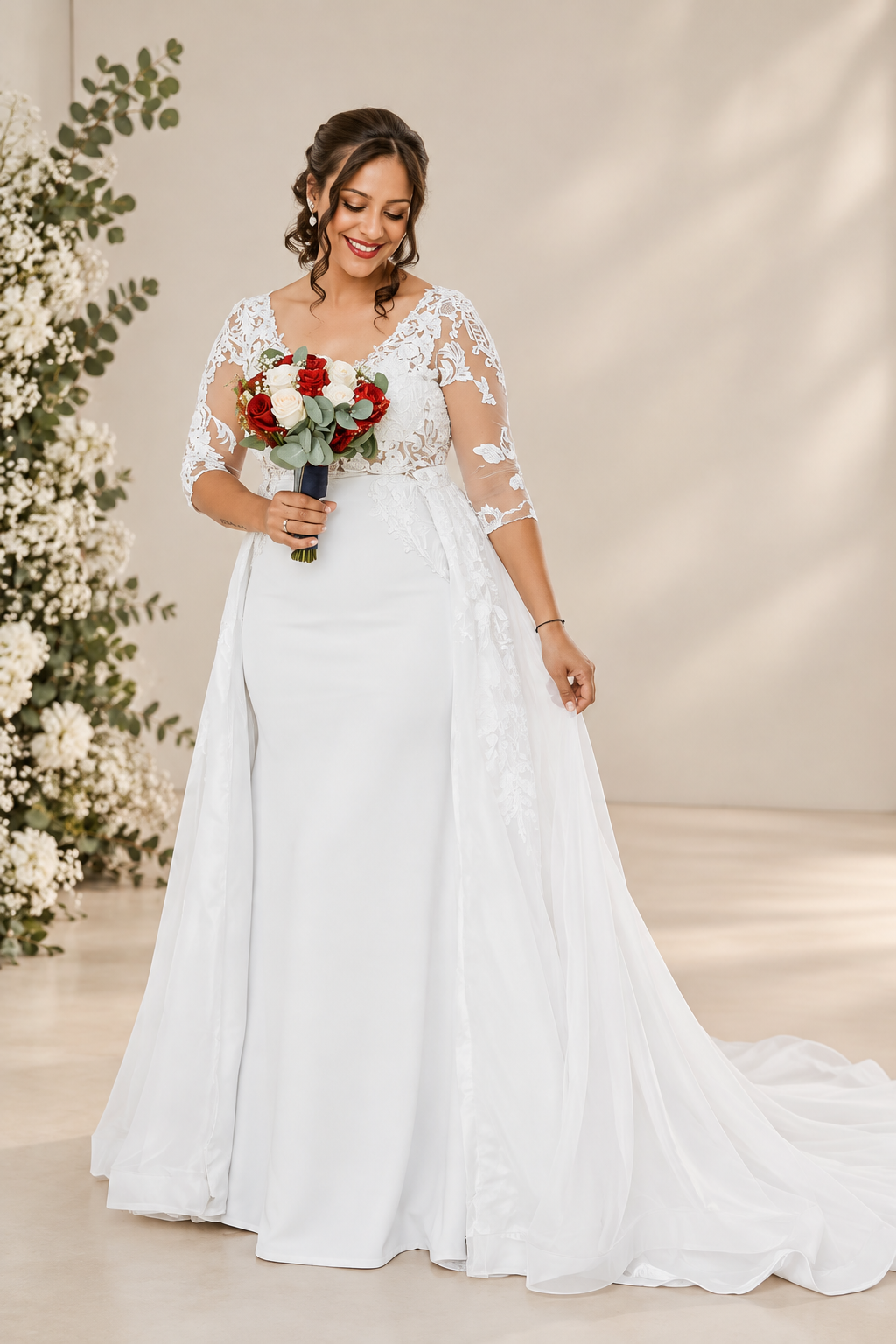 dominique Elegant off-white wedding dress featuring a structured crepe sweetheart bodice with statement shoulder ties and a full botanical lace A-line skirt with a beautiful flowing train.