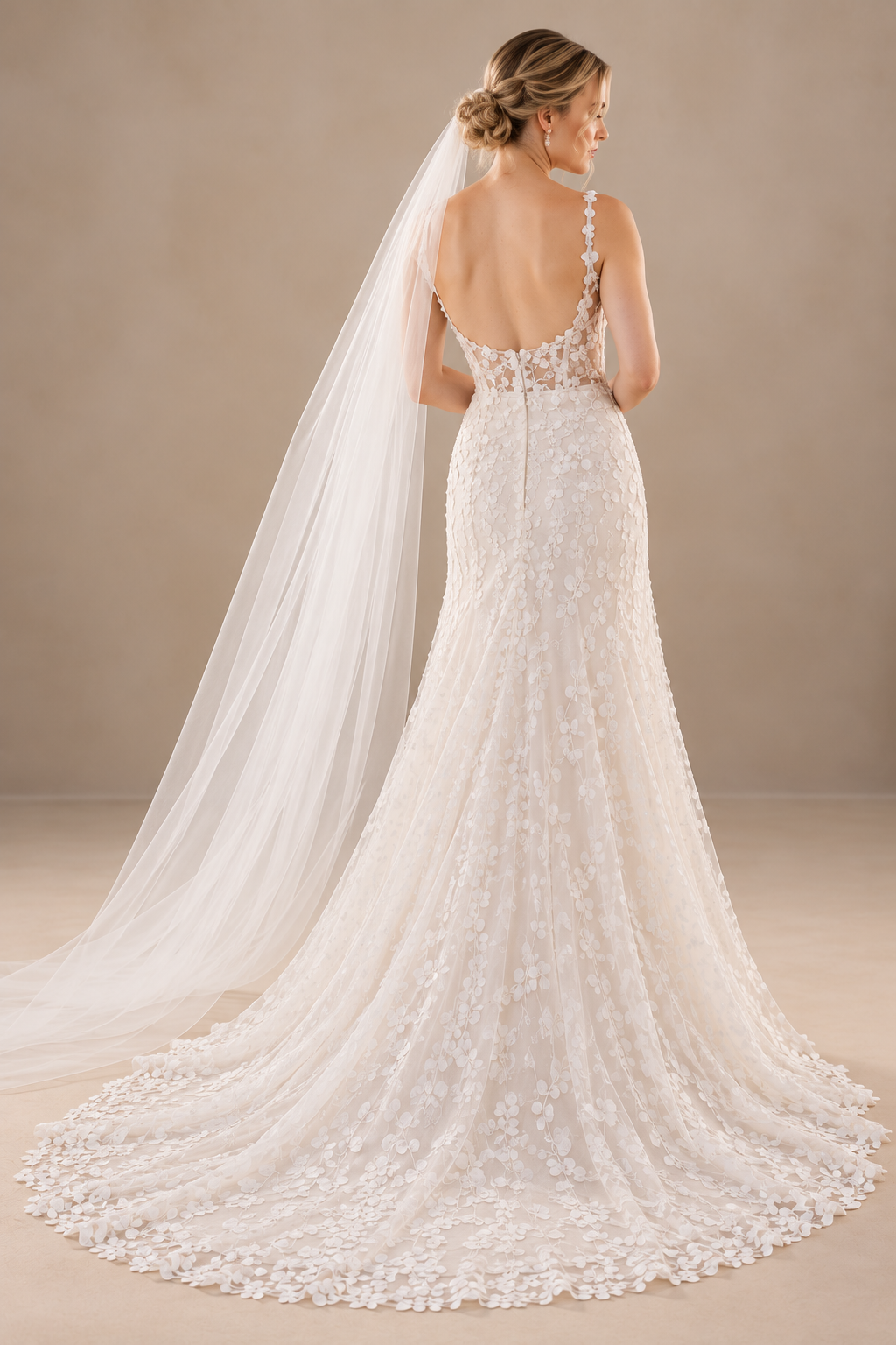 JOLENE A timeless mermaid wedding dress featuring a beautifully detailed lace bodice with a deep illusion V-neckline and delicate beaded straps. The sleek fitted silhouette flows effortlessly into a soft flared skirt and graceful lace-edged train