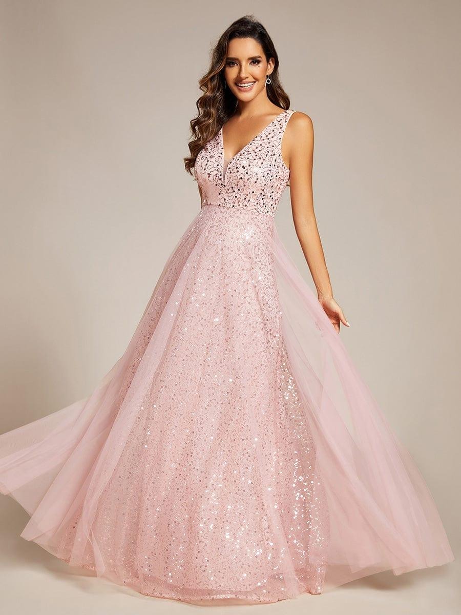 The perfect blend of elegance and allure, this V-neck evening dress boasts a high waist and sheer sequined tulle fabric, accentuating your figure beautifully.