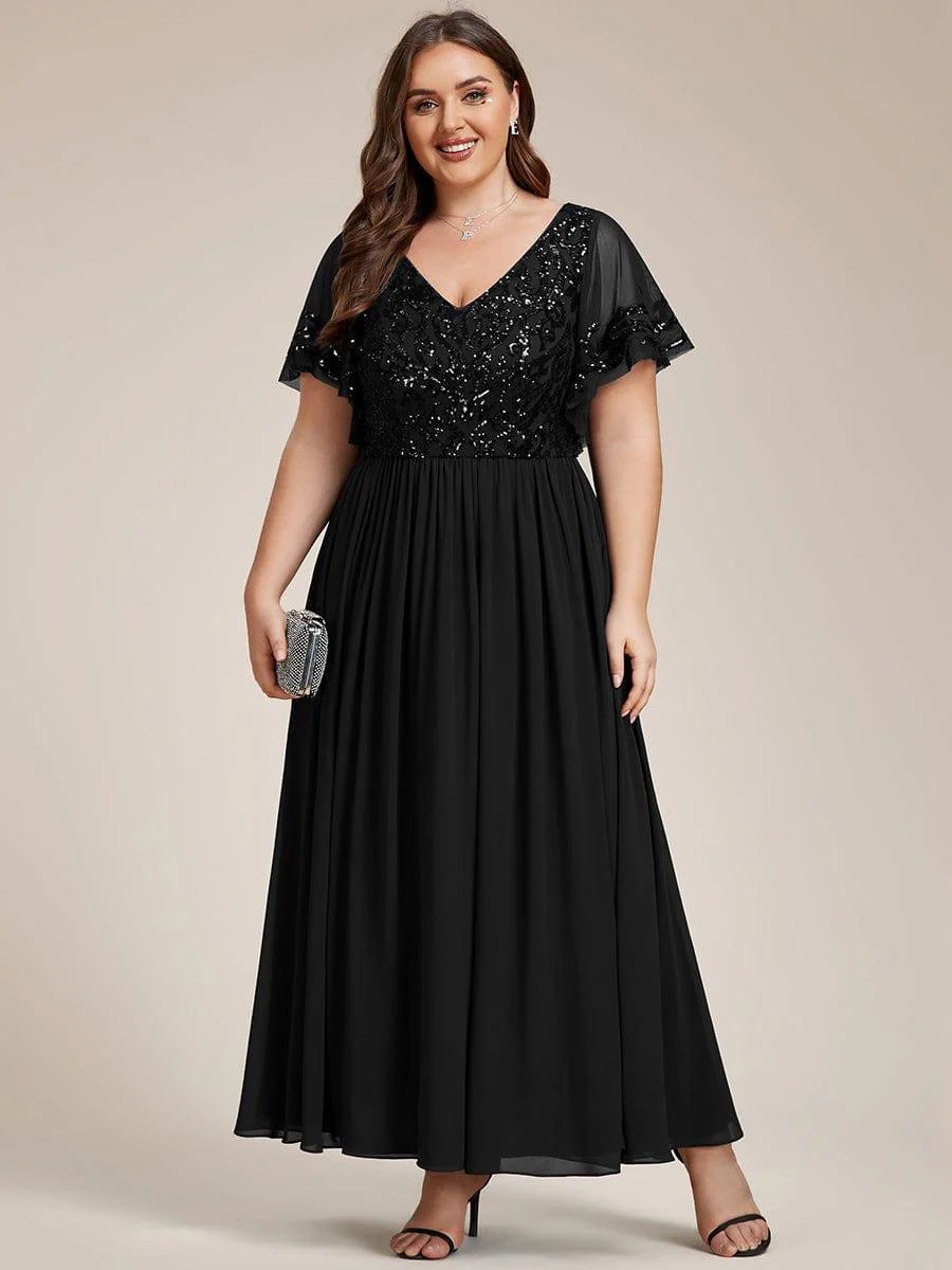 Hazel A sophisticated Mother of the Bride dress featuring a sparkling sequin V-neck bodice, soft short sleeves, and a smooth, flowing skirt for timeless elegance.  This dress is not currently in stock but is available to order.