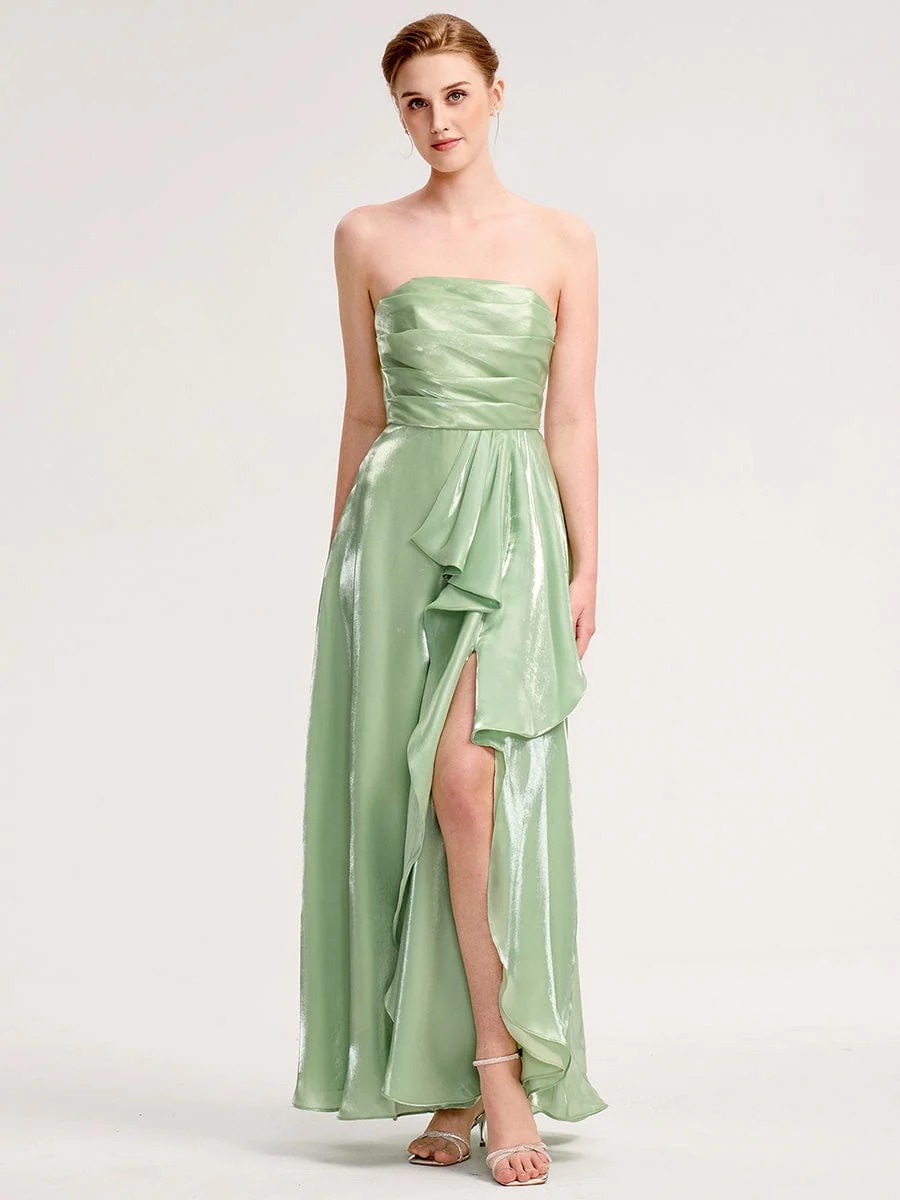 Elevate your evening style with this stunning green satin dress. Featuring a flattering silhouette, delicate spaghetti straps, and an elegant front slit, it offers both sophistication and comfort. The iridescent fabric catches the light beautifully, making it perfect for formal events or special occasions. Pair it with your favorite accessories for a complete look.