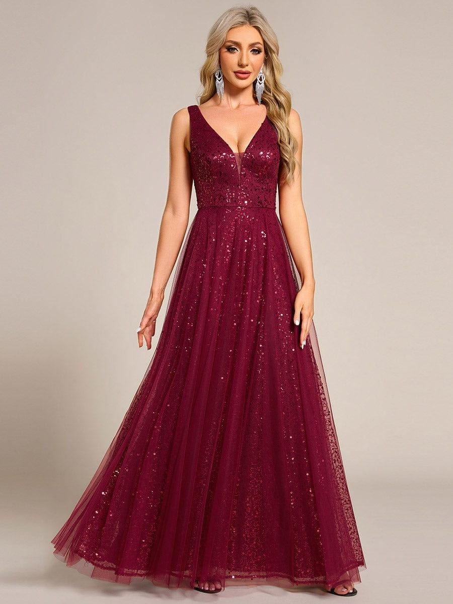 The perfect blend of elegance and allure, this V-neck evening dress boasts a high waist and sheer sequined tulle fabric, accentuating your figure beautifully.