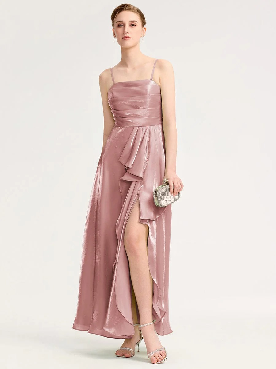 Elevate your evening style with this stunning green satin dress. Featuring a flattering silhouette, delicate spaghetti straps, and an elegant front slit, it offers both sophistication and comfort. The iridescent fabric catches the light beautifully, making it perfect for formal events or special occasions. Pair it with your favorite accessories for a complete look.