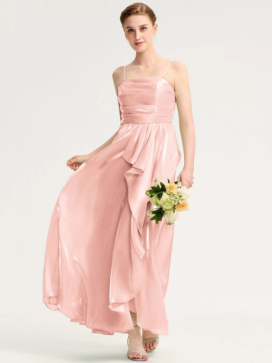Elevate your evening style with this stunning green satin dress. Featuring a flattering silhouette, delicate spaghetti straps, and an elegant front slit, it offers both sophistication and comfort. The iridescent fabric catches the light beautifully, making it perfect for formal events or special occasions. Pair it with your favorite accessories for a complete look.