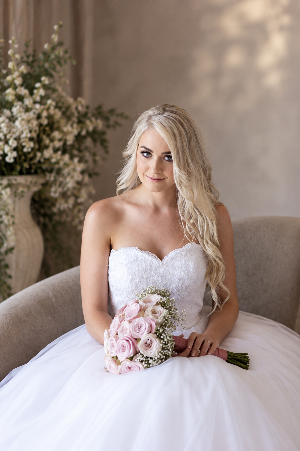 JOLENE A timeless mermaid wedding dress featuring a beautifully detailed lace bodice with a deep illusion V-neckline and delicate beaded straps. The sleek fitted silhouette flows effortlessly into a soft flared skirt and graceful lace-edged train