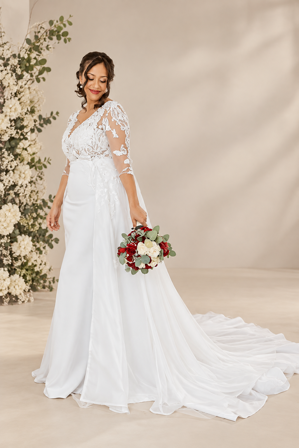dominique Elegant off-white wedding dress featuring a structured crepe sweetheart bodice with statement shoulder ties and a full botanical lace A-line skirt with a beautiful flowing train.