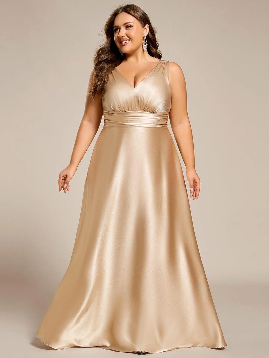 This plus-size satin maxi bridesmaid dress offers a blend of comfort and elegance. The empire waist design flatters every figure, while the soft satin fabric creates a smooth, luxurious look. Convenient side pockets add a practical touch, making it perfect for weddings and formal events where both style and functionality are key.