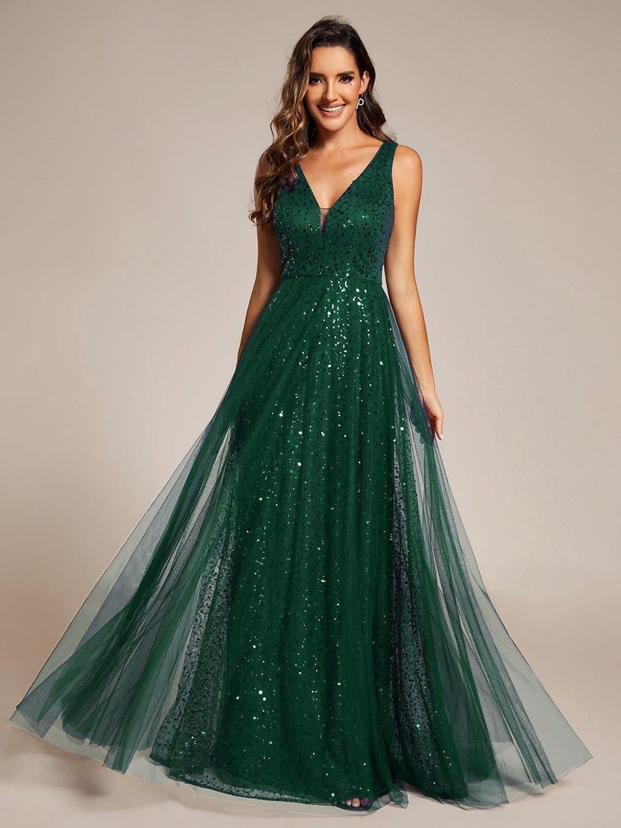 The perfect blend of elegance and allure, this V-neck evening dress boasts a high waist and sheer sequined tulle fabric, accentuating your figure beautifully.