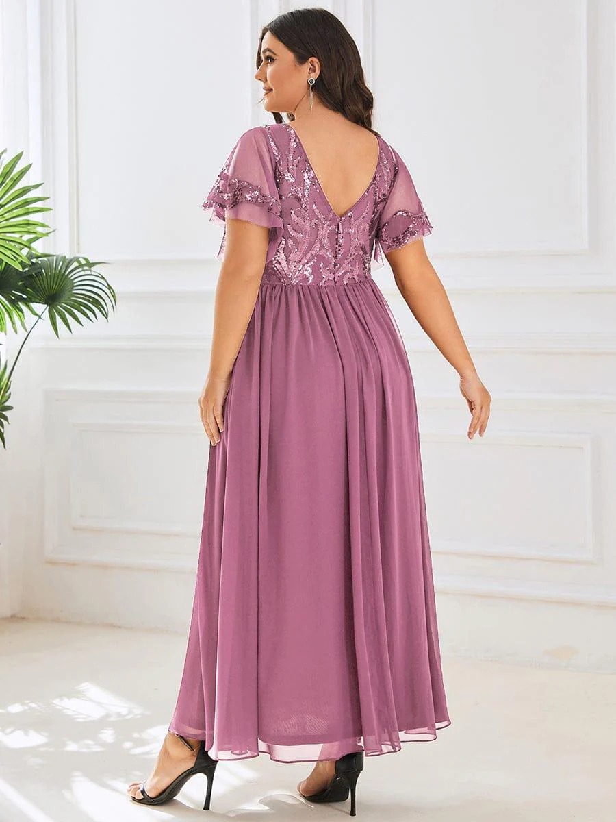 Hazel A sophisticated Mother of the Bride dress featuring a sparkling sequin V-neck bodice, soft short sleeves, and a smooth, flowing skirt for timeless elegance.  This dress is not currently in stock but is available to order.