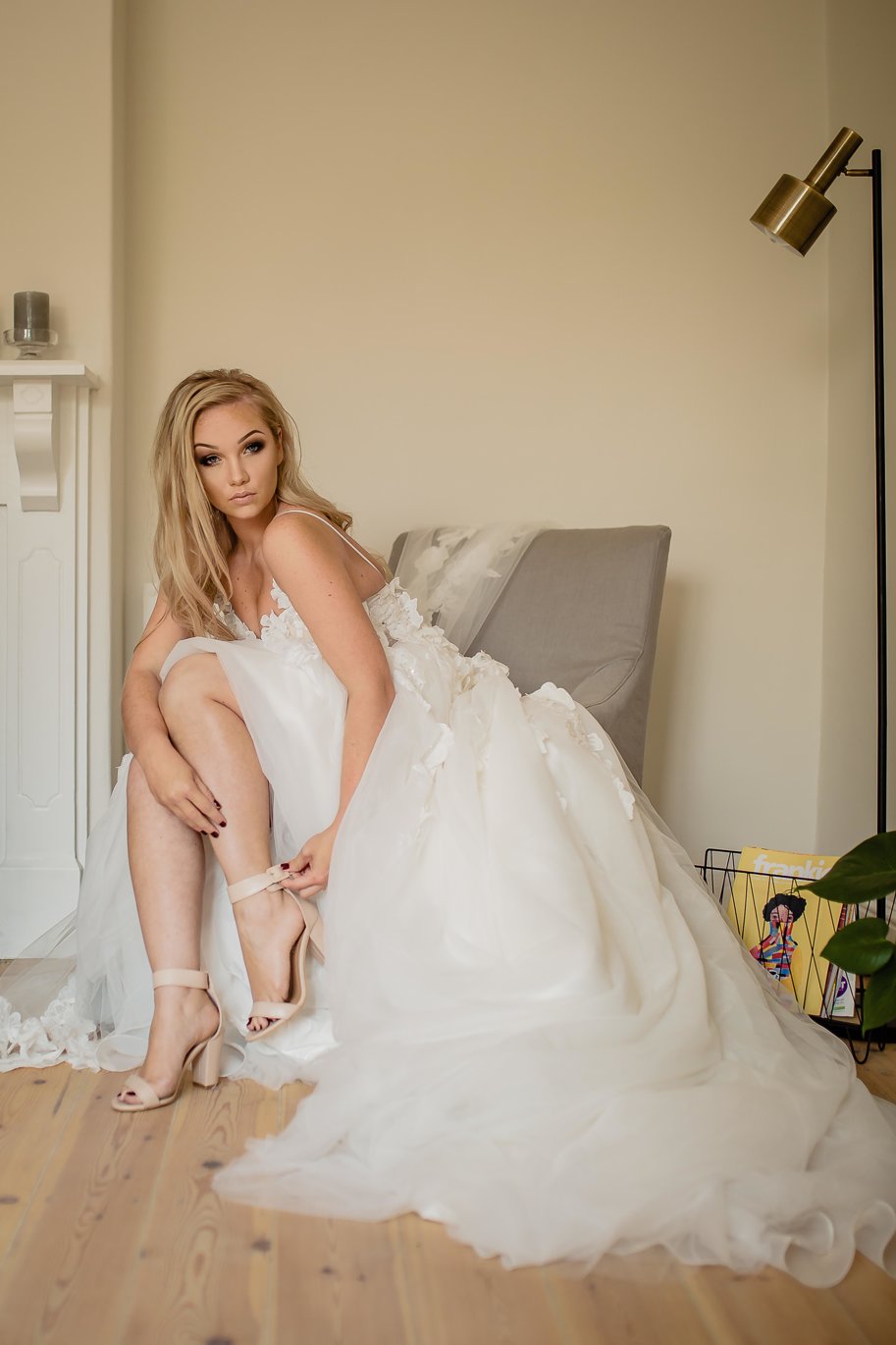 liezel 3D Floral Lace & Tulle Ball Gown with Romantic Princess Silhouette  The Liezel gown is a dreamy floral-inspired ball gown, perfect for the bride who wants to feel like a modern-day princess. Crafted from layers of soft tulle and adorned with 3D floral lace appliqués, this gown offers texture, dimension, and graceful movement with every step.  ✨ Design Highlights: ✔ Sheer Lace Bodice – Adorned with delicate 3D floral appliqués, creating a whimsical and romantic look. ✔ Thin Straps – Light and elegant, keeping the focus on the intricate bodice. ✔ Princess-Cut A-Line Skirt – Full-flare tulle design for a soft, floating effect. ✔ 3D Floral Lace Details – Scattered throughout the skirt for a cohesive, garden-inspired feel. ✔ Low Zipper Back – Clean and modern with a secure, flattering fit. ✔ Long Flowing Train – Adds ethereal drama to your bridal entrance.  💫 Customization Options: ✅ Custom sizing available for a tailored fit ✅ Option to adjust neckline, strap width, or back style ✅ Add a beaded belt or sleeves for a personalized finish ✅ Available in blush, ivory, or soft white tones  👑 The Liezel gown is for the bride who dreams of a fairytale look filled with texture, elegance, and floral beauty. 👑  📞 Book your custom consultation today! 📧 info@bestersbridal.co.za | 📱 084 268 1354  3D Floral Lace • Sheer Bodice • Tulle Princess Skirt • Long Train • Zipper Back