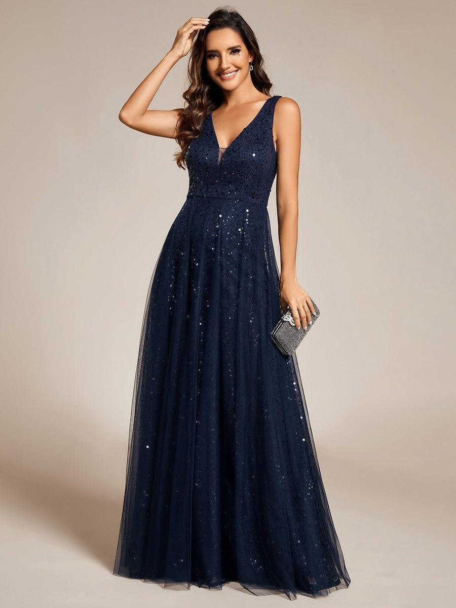 The perfect blend of elegance and allure, this V-neck evening dress boasts a high waist and sheer sequined tulle fabric, accentuating your figure beautifully.